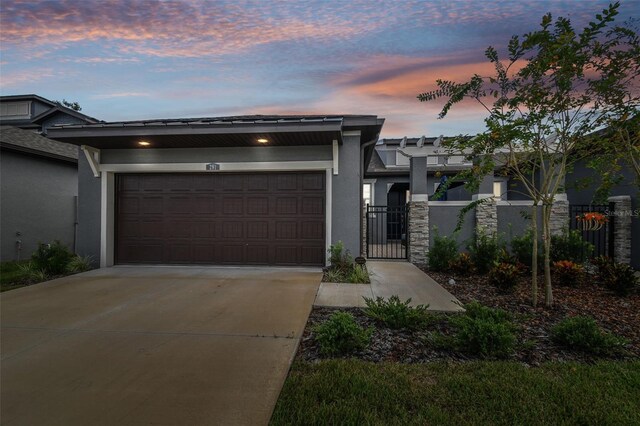281 Villa Corte Dr, Lutz, FL 33549 - view of front of house with stucco siding, driveway, and a garage