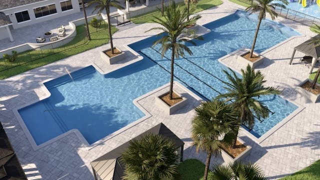 pool featuring a patio and fence