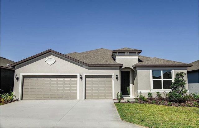 4457 SW 84th Street Rd, Ocala, FL 34476 - view of front of home featuring concrete driveway, an attached garage, stucco siding, roof with shingles, and a front lawn