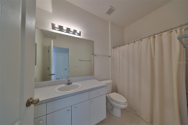 bathroom featuring toilet, tile patterned floors, curtained shower, a textured ceiling, and vanity