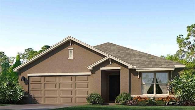 view of front of home featuring a garage and a front lawn