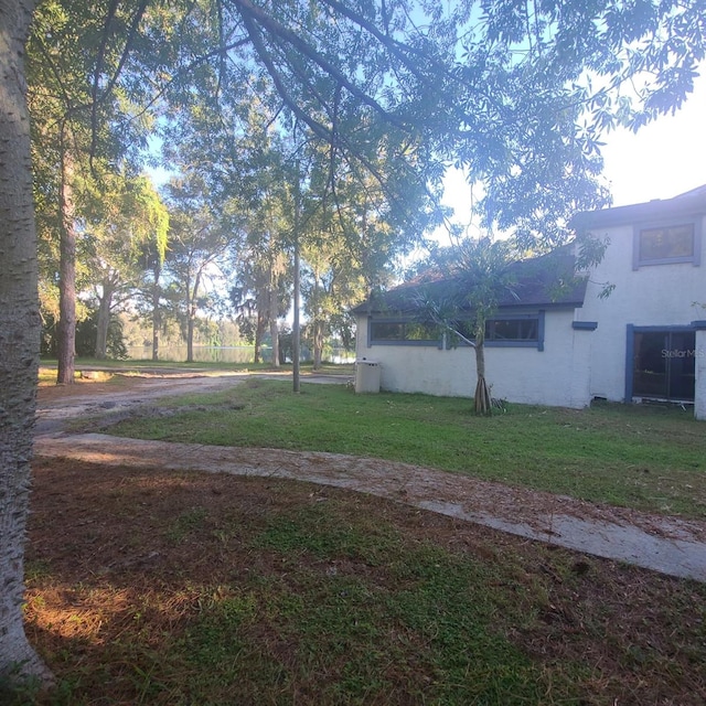 2400 Pine Hammock, Clearwater, FL 33764 - view of green lawn with driveway