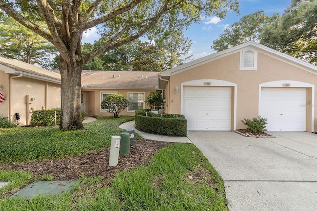 ranch-style home with a garage