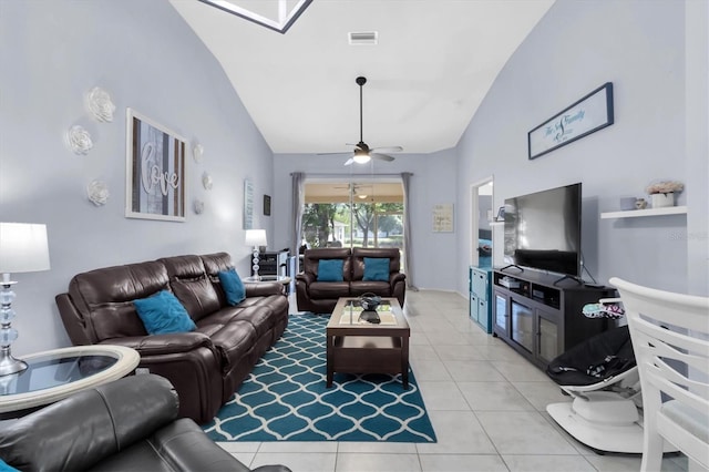 living room with ceiling fan, light tile patterned floors, and high vaulted ceiling