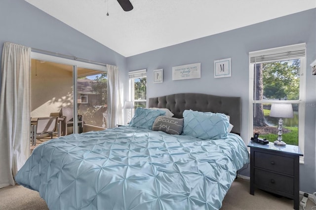 carpeted bedroom with multiple windows, vaulted ceiling, and ceiling fan