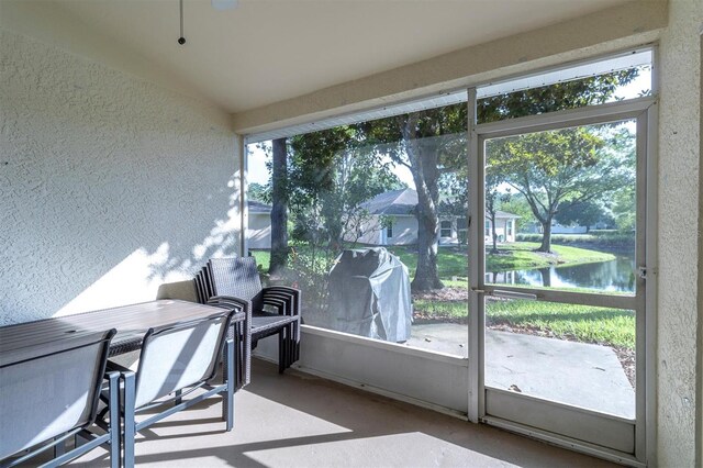 office featuring a water view and a healthy amount of sunlight