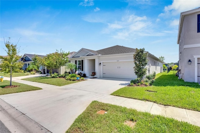 view of front of home with a garage and a front lawn