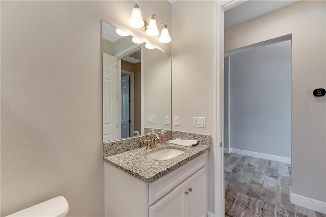 bathroom with vanity and hardwood / wood-style floors