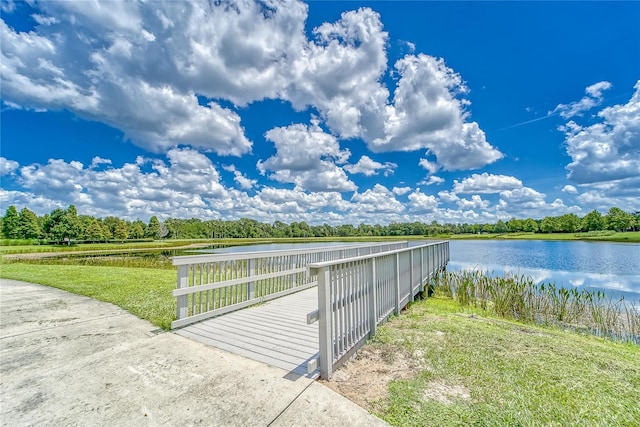 exterior space featuring a yard and a water view