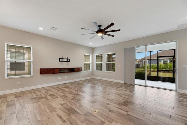 unfurnished room with ceiling fan and light hardwood / wood-style flooring