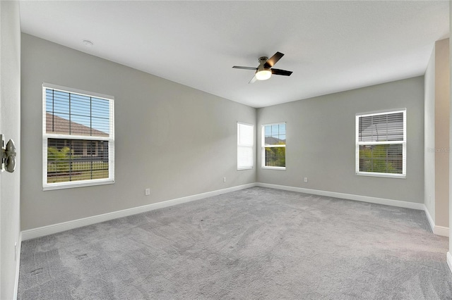 empty room with light carpet and ceiling fan