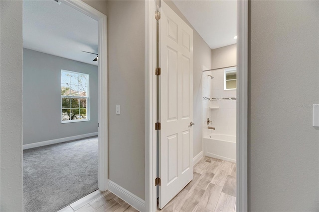 hall with light hardwood / wood-style flooring