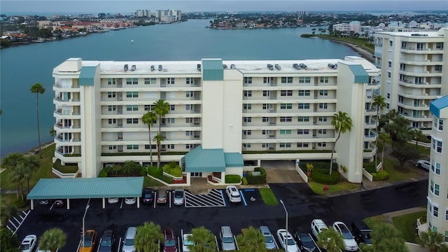 birds eye view of property with a water view