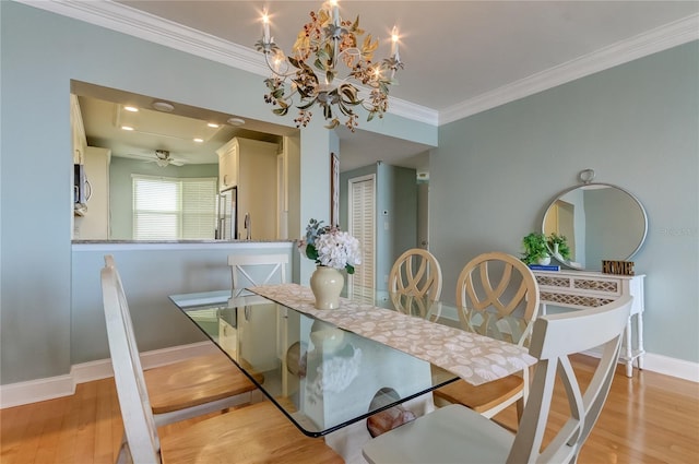 dining area with ceiling fan with notable chandelier, light hardwood / wood-style floors, sink, and crown molding