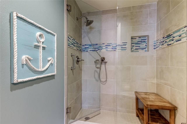 bathroom featuring a shower with shower door