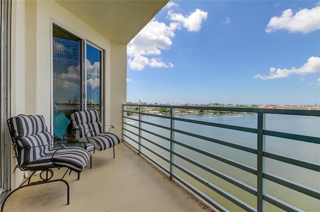 balcony featuring a water view