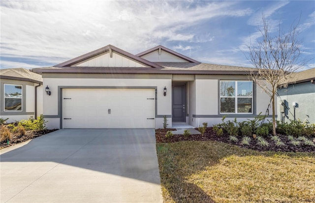 view of front of home with a garage and a front lawn