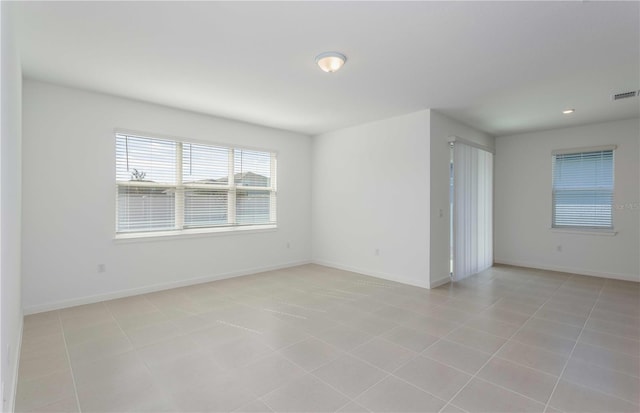 empty room featuring light tile patterned floors