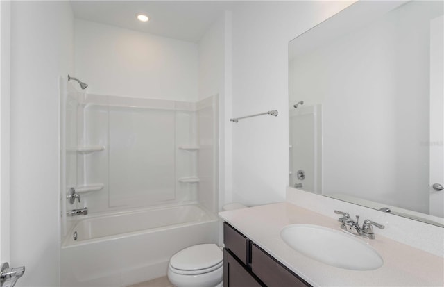 full bathroom featuring vanity,  shower combination, and toilet