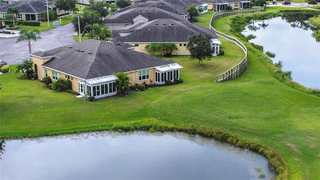 drone / aerial view with a water view