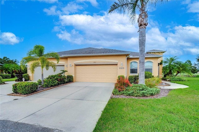 view of front of home featuring a garage and a front yard