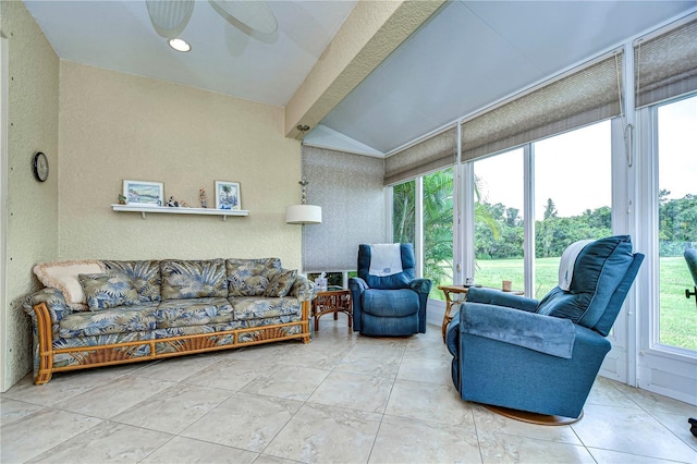 sunroom featuring ceiling fan