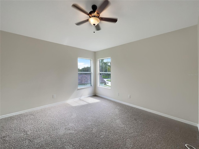 carpeted empty room with ceiling fan