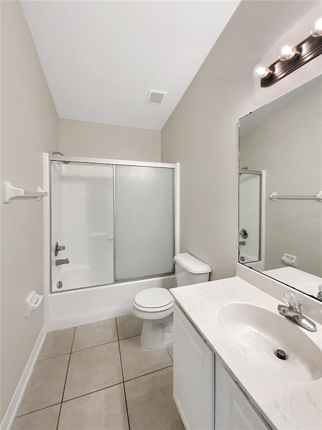 full bathroom featuring vanity, tile patterned floors, toilet, and combined bath / shower with glass door