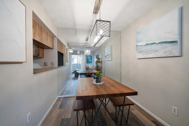 dining room featuring dark wood-type flooring