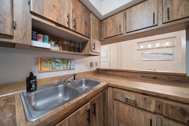 kitchen featuring sink and wood counters