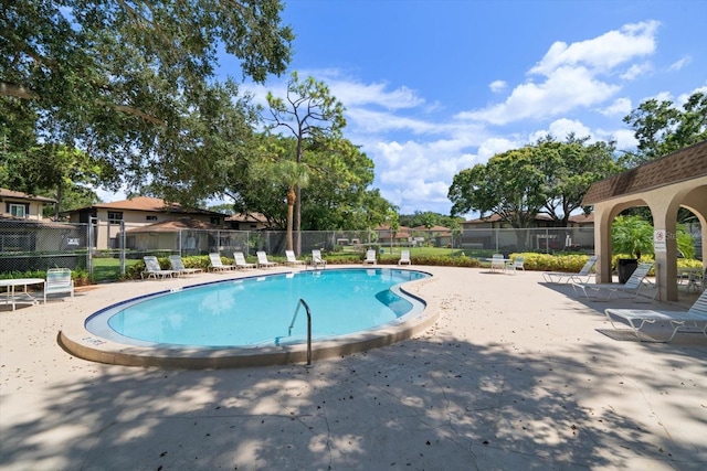 view of swimming pool with a patio