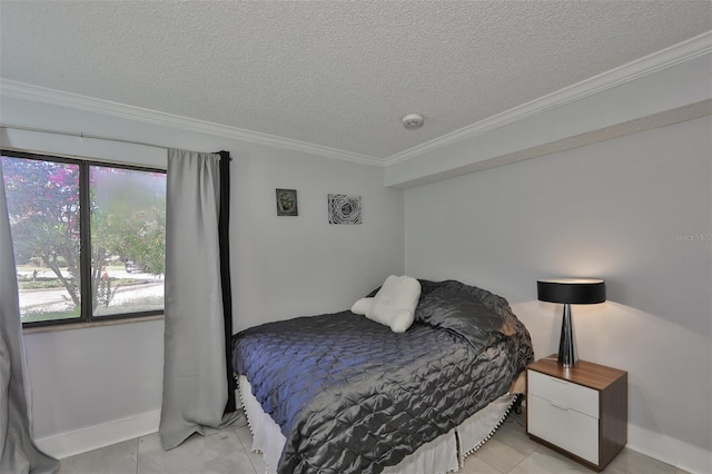 bedroom featuring a textured ceiling, crown molding, and baseboards