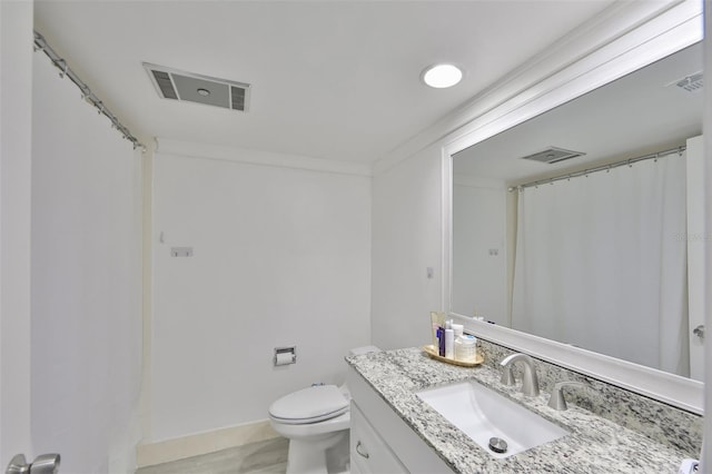 full bathroom with visible vents, vanity, and toilet