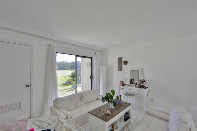 living area featuring a textured ceiling and marble finish floor