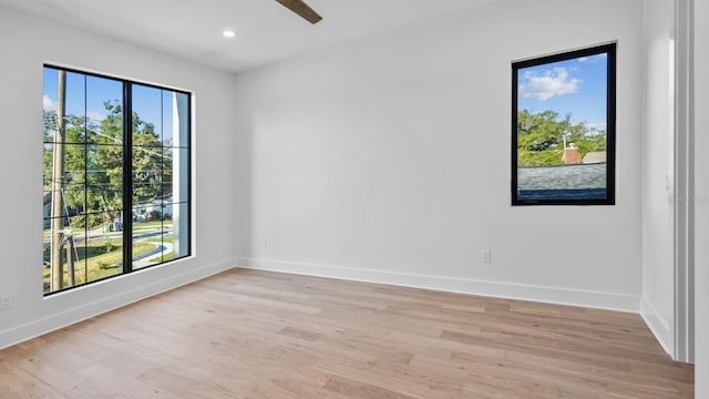unfurnished room featuring light wood-style flooring, baseboards, recessed lighting, and a ceiling fan