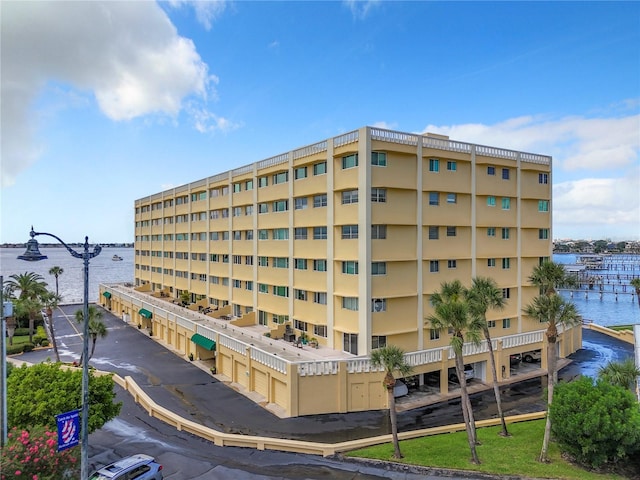 view of building exterior with a water view