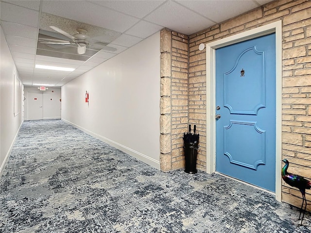 view of exterior entry featuring ceiling fan