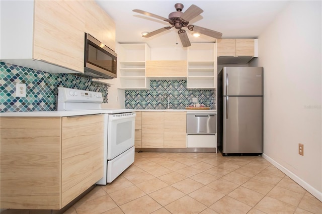 kitchen with ceiling fan, light brown cabinets, stainless steel appliances, and backsplash