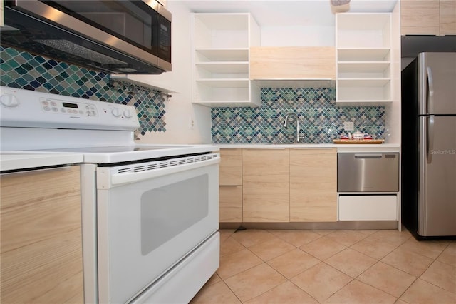 kitchen with stainless steel appliances, light brown cabinetry, light tile patterned flooring, and tasteful backsplash