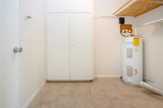 utility room with electric water heater