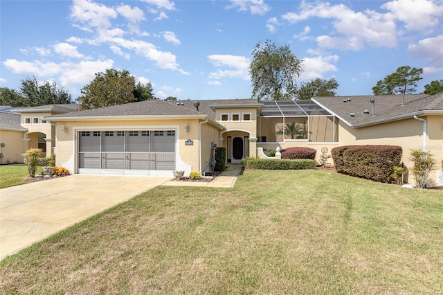 view of front of home with a front yard and a garage