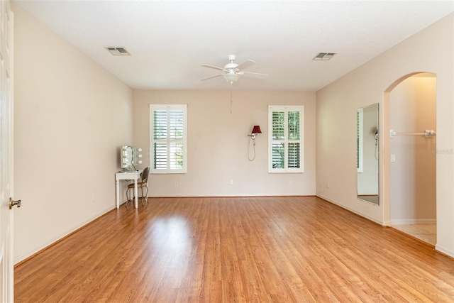 unfurnished room with ceiling fan and light hardwood / wood-style flooring