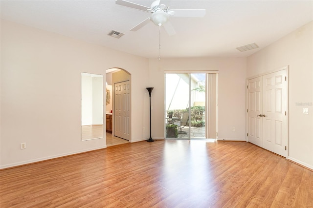 spare room featuring light wood-type flooring and ceiling fan