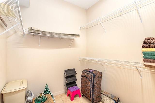 spacious closet with light tile patterned flooring