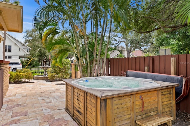 view of patio / terrace featuring a hot tub