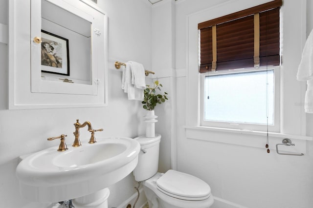 bathroom with sink and toilet