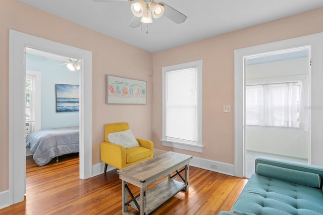 interior space with ceiling fan and hardwood / wood-style flooring