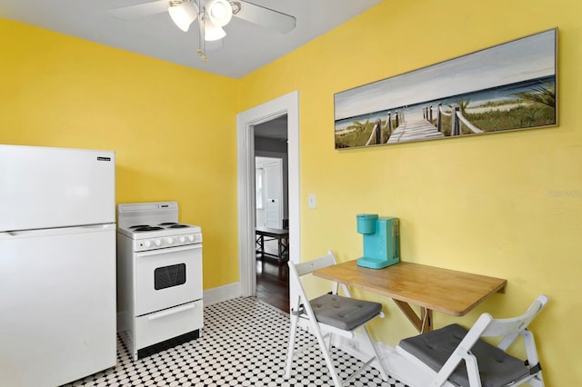 kitchen featuring ceiling fan and white appliances