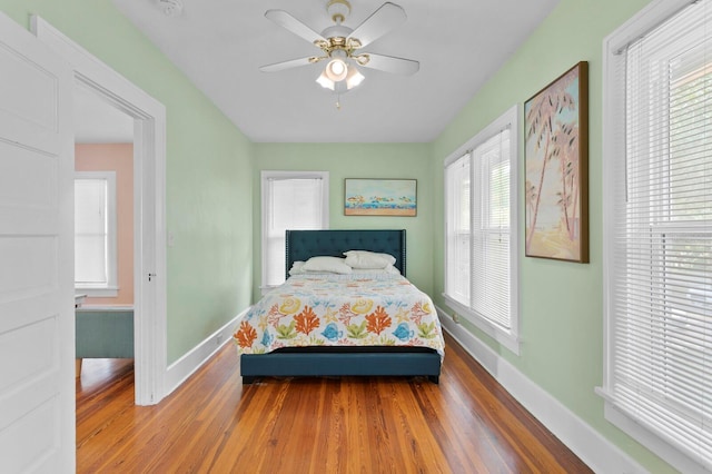 bedroom featuring ceiling fan and hardwood / wood-style flooring