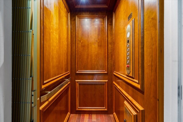 room details featuring elevator and ornamental molding